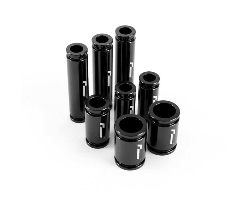 Racingline-DSG-Gearbox-Billet-Oil-Feed-Tubes-DQ500-DQ381-VWR040302_4jpg - OPSHOLDERS Cluster of glossy black cylindrical tubes with white markings on a white background.