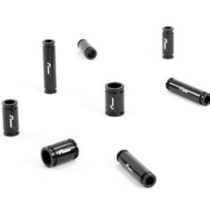 Racingline-DSG-Gearbox-Billet-Oil-Feed-Tubes-DQ500-DQ381-VWR040302_5jpg - OPSHOLDERS Several black cylindrical metal pieces with a white logo scattered on a white background, open ends visible for each tube, likely small adapters or spacers.