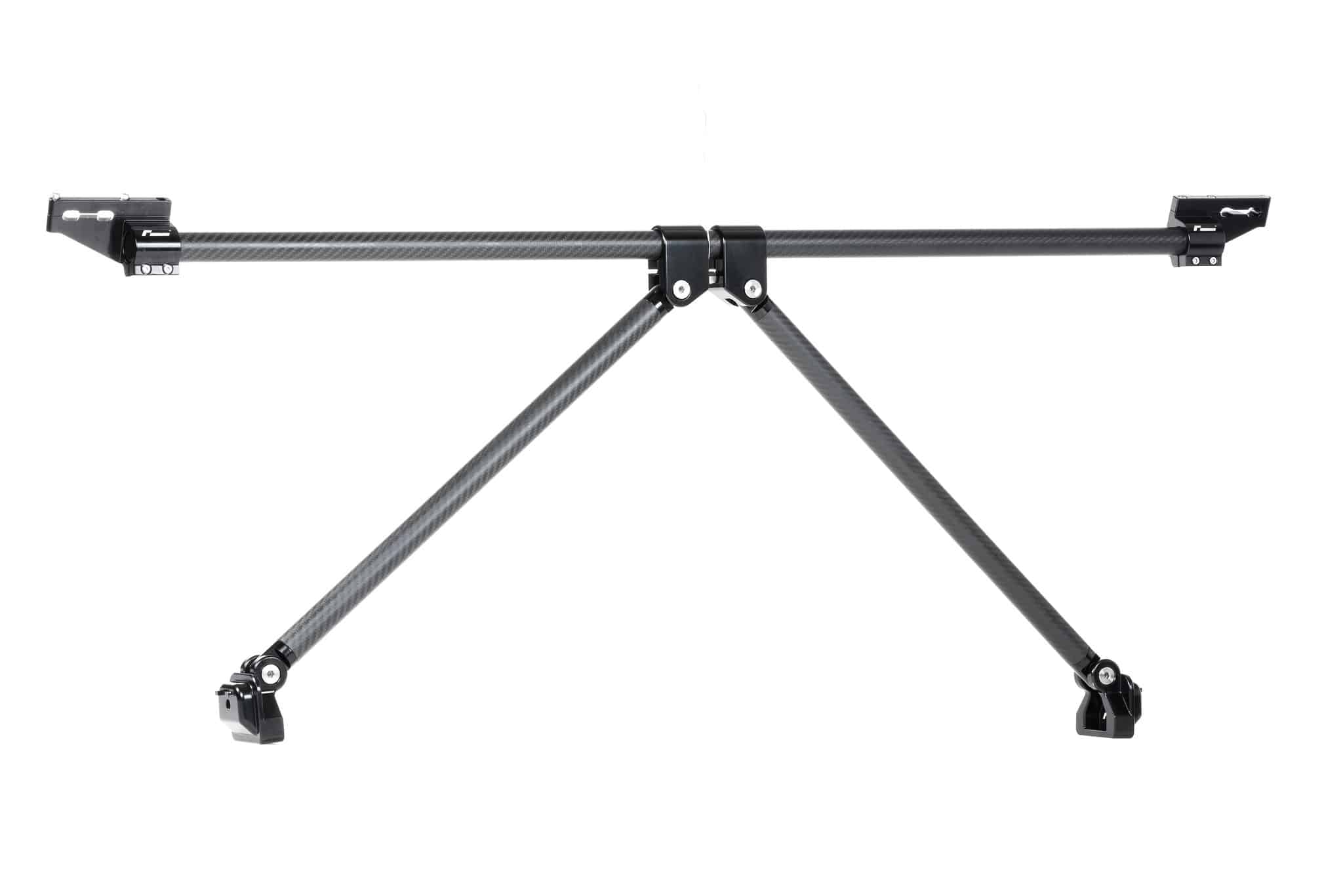 Racingline-MQB-Carbon-Brace-1jpg - OPSHOLDERS Carbon fiber camera rig with a central joint and two horizontal arms extending left and right, secured by clamps.