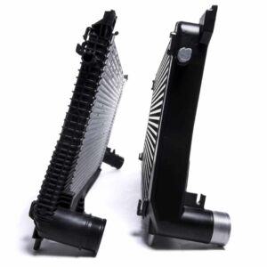 Racingline-MQB-Intercooler-1-1jpg - OPSHOLDERS Two black automotive radiators standing upright and leaning toward each other on a white background