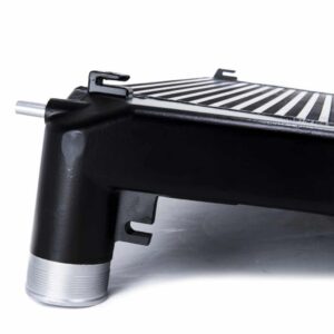 Racingline-MQB-Intercooler-5-1jpg - OPSHOLDERS Close-up of a black car radiator with metal fins and mounting brackets.