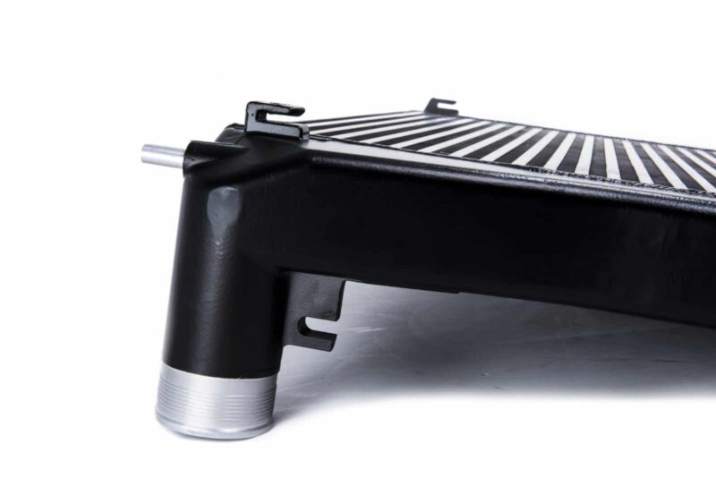 Racingline-MQB-Intercooler-5-1jpg - OPSHOLDERS Close-up of a black car radiator with metal fins and mounting brackets.