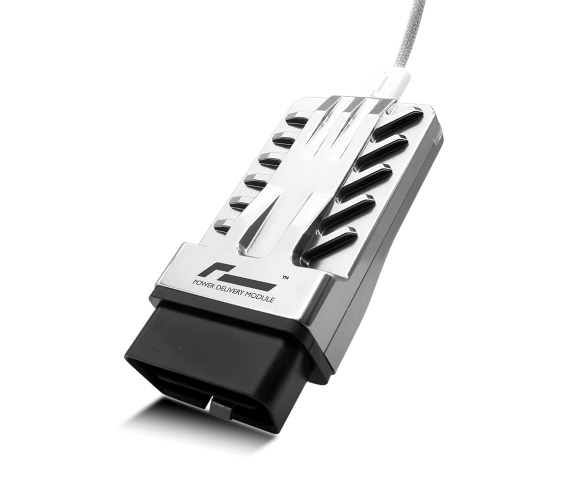 Racingline-PDM-Home-Tuning-VWR031000-1jpg - OPSHOLDERS Power Delivery Module device with a metallic housing and braided cable, labeled 'Power Delivery Module'