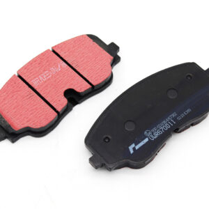 Two brake pads for a car, one with red friction material and the other showing the dark backing plate on a white background.
