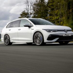 Racingline_Springs_MK8R-Estate_1jpg - OPSHOLDERS White Volkswagen station wagon driving at speed on a racetrack with blurred pavement and trees in the background