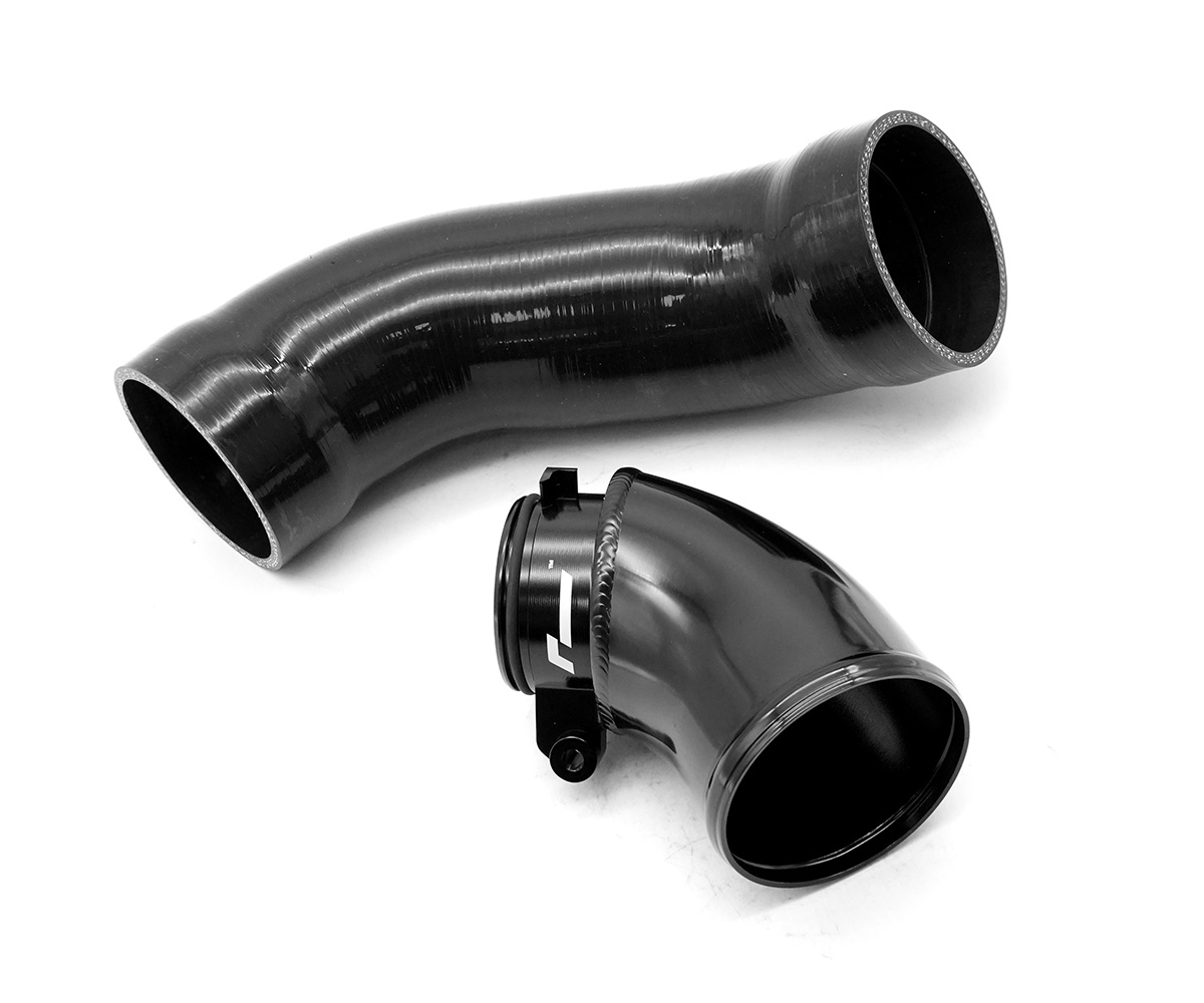 VWR120005_1jpg - OPSHOLDERS Black curved automotive duct elbow with a matching straight hose section and a clamp.