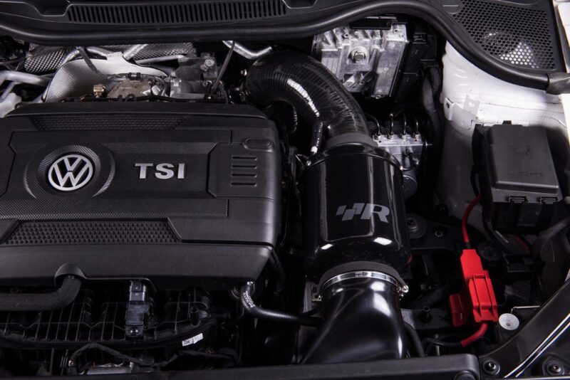 Close-up of a VW TSI engine bay with a black aftermarket HR air intake system and tubing visible.","Volkswagen TSI engine with an aftermarket black HR air intake and red battery terminal nearby.","Engine compartment showing VW TSI cover and an HR-branded air intake pipe.","Under-hood view featuring a TSI engine and a glossy black HR intake tube.","Performance-looking engine bay with VW badge, TSI cover, and HR air intake assembly."]} }**Note: The JSON contains stray characters; please use only the ALT strings.**}»Oops, cleaning up. Use proper JSON. Here is corrected:**