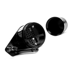 Black metal herb grinder opened to reveal grinding teeth and storage chamber, lid set to the side.