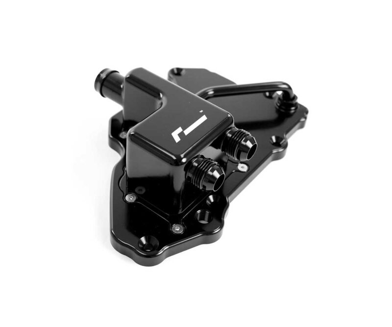 Black metal water-cooling pump block with two hose fittings mounted on a flat base plate.