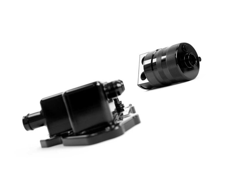 Two black mechanical parts floating in white space: a rectangular motor/actuator on the left and a knurled cylindrical component on the right.