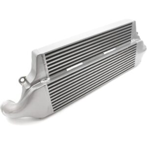 Aluminum automotive intercooler core with fins and end tanks, used in a turbocharged engine on a white background’s surface