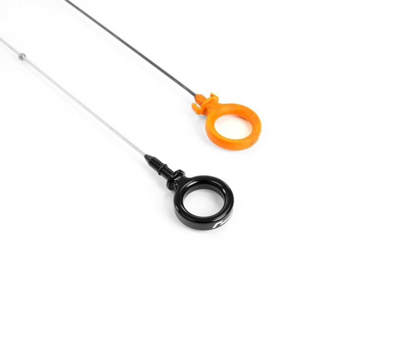 VWR190010_2jpg - OPSHOLDERS Two circular ring handles—black and orange—each attached to a thin cable on a white background.