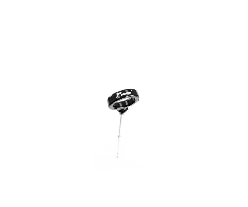 VWR190010_7jpg - OPSHOLDERS Glossy black ring with white markings, suspended on a thin metal wire against a white background.