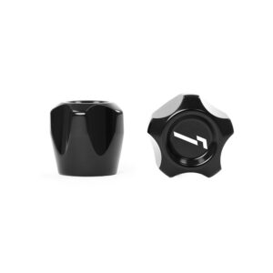 Two black metal knobs with star-shaped grips on a white background; right knob shows a white diagonal logo.
