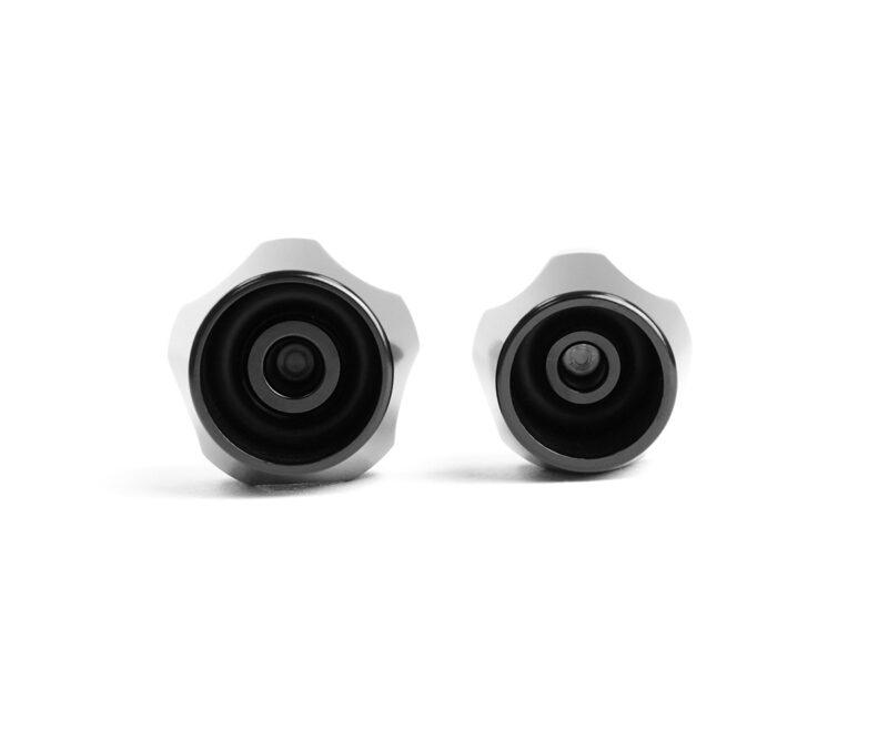 Pair of gray star-shaped knobs with black recessed centers on a white background.