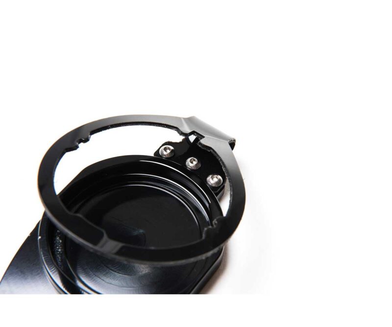Close-up of a black camera lens mount with a circular ring and three visible screws on a white background