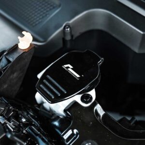 Close-up of a motorcycle handlebar featuring a black glossy throttle/adjustment plate labeled 'Perfect Performance' mounted near the grip.