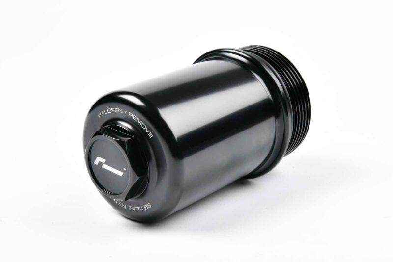 Black cylindrical canister with a threaded end and a removable cap, showing 'LÖSEN / Remove' on the edge.