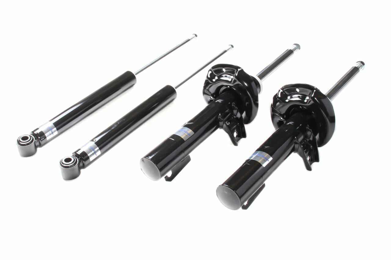 VWR30G500-1__726131528272774-1jpg - OPSHOLDERS Set of black car shock absorbers and struts laid out on a white background