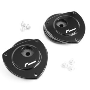 Pair of black round mounting plates with central bore and four corner holes, plus small screws (car/gear hardware).