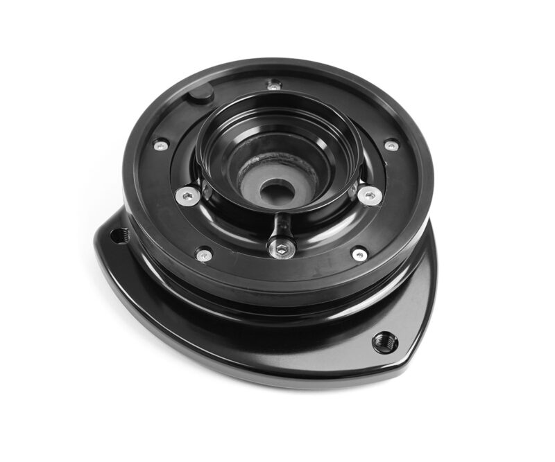 VWR430000_3jpg - OPSHOLDERS Close-up of a black circular automotive mounting hub with screws and a central bore.