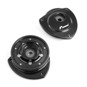 VWR430000_9jpg - OPSHOLDERS Disassembled automotive suspension component: two black circular mounts with central holes and mounting screws, shown at an angle on white background