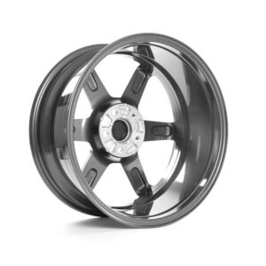 VWR610401_1jpg - OPSHOLDERS Shiny chrome alloy car wheel rim with five spokes, viewed at an angle showing the hub and lug nut holes