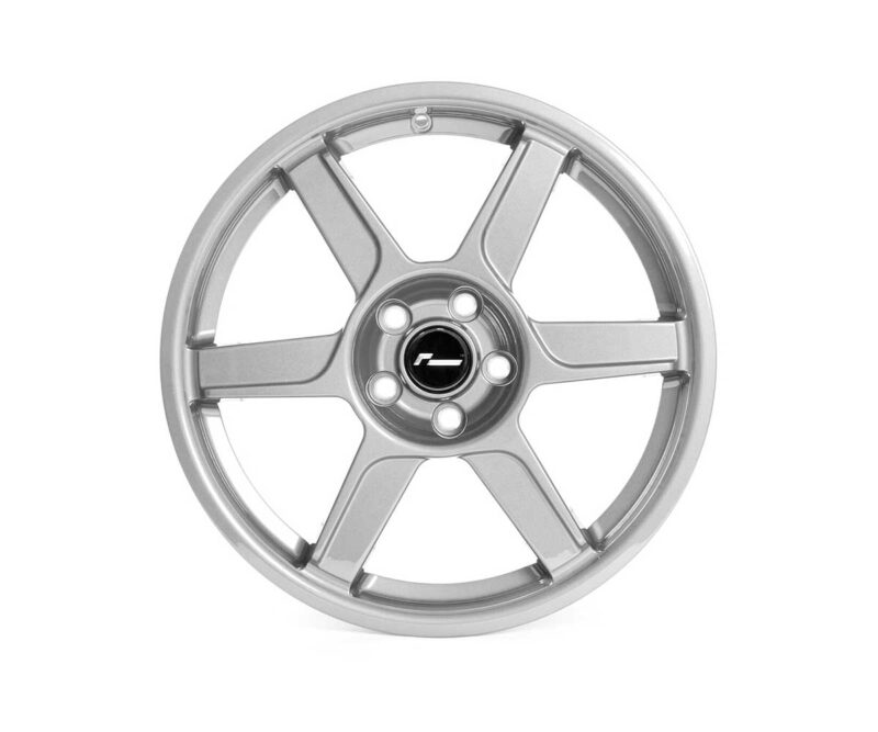 Silver five-spoke alloy wheel with a black center cap and visible lug nut holes around it.