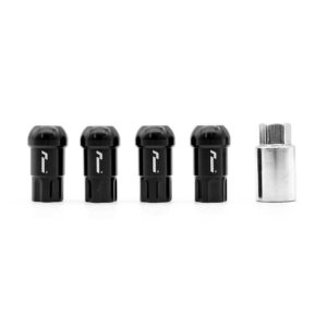 Four black cylindrical components with rounded tops arranged in a row beside a small silver hex tool on a white background, photographed in a studio.