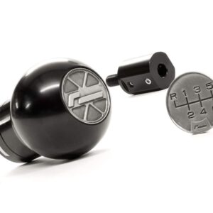Black spherical manual gear shift knob with a 6-speed gear pattern and detached shaft on a white background