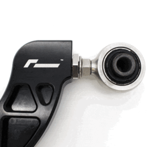 Close-up of a black ergonomic tool handle with a silver bearing head at the tip.