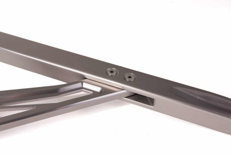 audi-b9-a4s4-strut-brace_28703499898_o-1jpg - OPSHOLDERS Close-up of a stainless steel hinge with two screws on a metal frame.