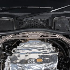 audi-b9-a4s4-strut-brace_42525934122_o-1jpg - OPSHOLDERS Under-hood view of a car engine bay with a silver crossmember brace spanning the front and various hoses visible beneath it