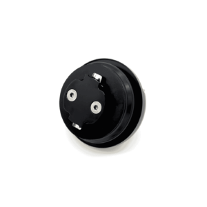 Close-up of a black circular mechanical part with silver screws on a white background.