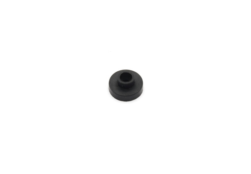 Small black rubber washer with a central hole on a white background, viewed from above