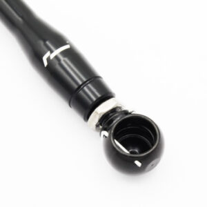 Close-up of a black cylindrical tool with a detachable cap and inner threading on a white surface.