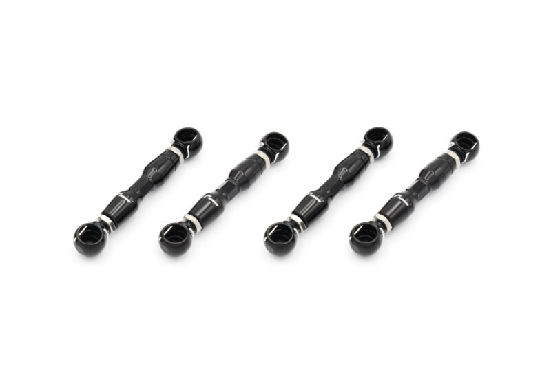 Four black scuba regulator mouthpieces arranged diagonally on a white background, showcasing the gear. - (Informative image)