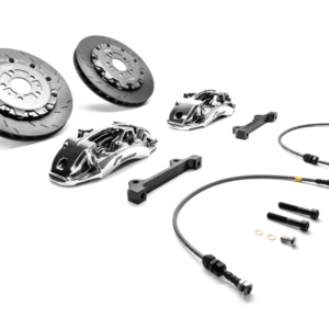 Disassembled high-performance car brake kit with rotors, calipers, lines, brackets and hardware.