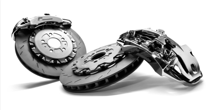 Two metallic brake rotors with calipers arranged diagonally on a white background.