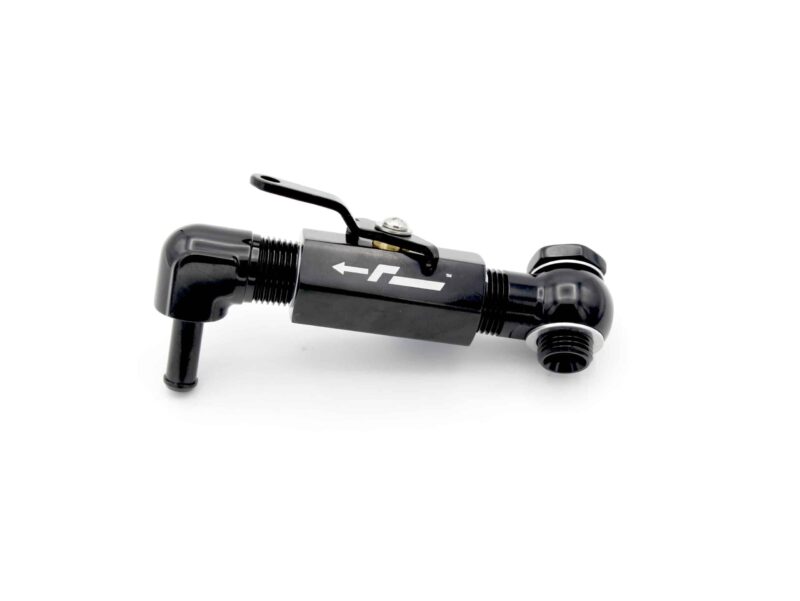 Close-up of a black bicycle handlebar with a brake lever and gear shifter, showing an arrow logo on the bar