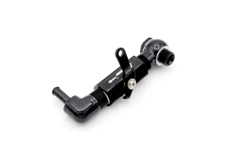 Close-up of a black bicycle derailleur with pulley wheel against a white background.