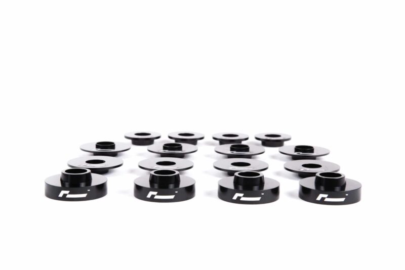 dead-set-3_45820378832_o-scaled-2jpg - OPSHOLDERS Row of black camera lens caps with white logos arranged in a grid on a white background