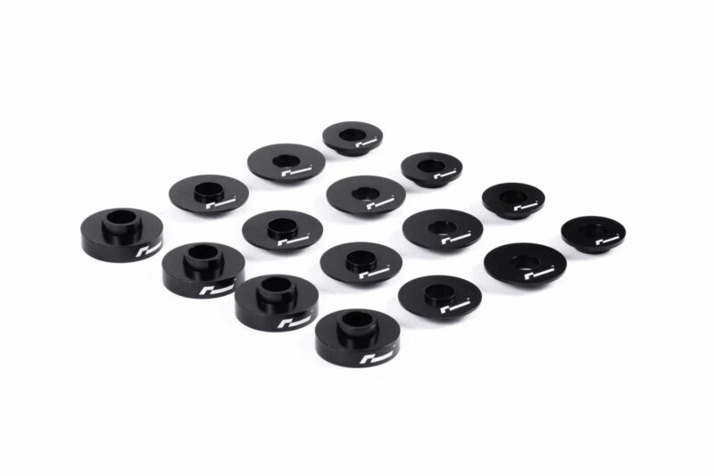 dead-set-7_30930701877_o-scaled-2jpg - OPSHOLDERS Cluster of black circular spacers with central holes and white markings on a white background