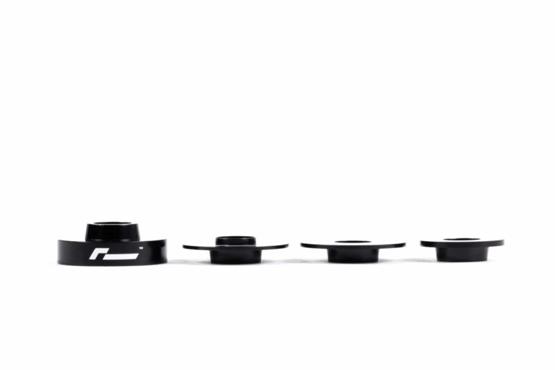 dead-set-9_30930698847_o-scaled-2jpg - OPSHOLDERS Row of black camera lens caps in various sizes lined up on a white background with a visible logo on the left cap.