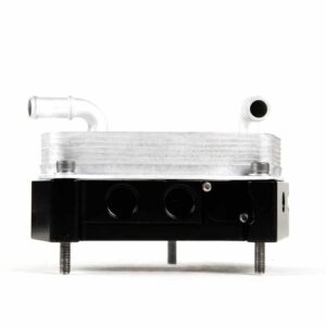 Aluminum hydraulic valve manifold with two top pipe fittings mounted on a black base with bolts.