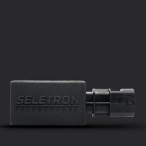 SELETRON Performance module with an attached plug-style connector on a dark background.