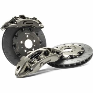 High-performance brake rotors and calipers laid out as a complete brake system set.