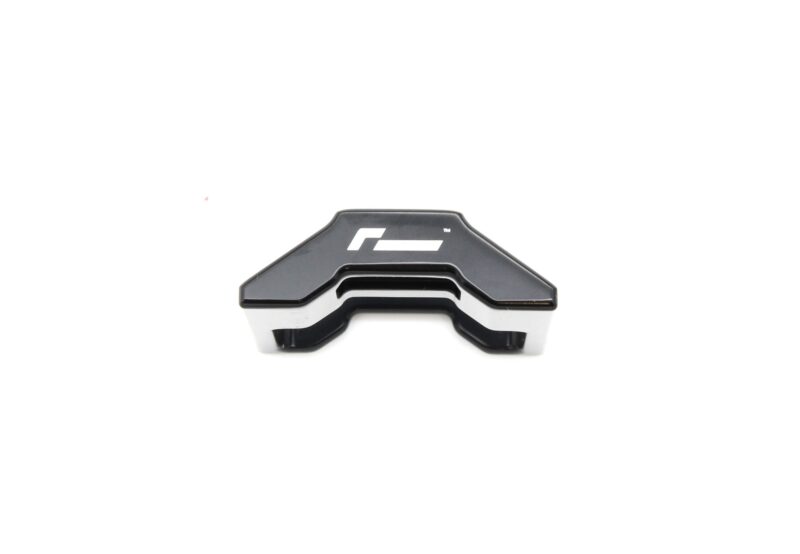 lower-motor-mount-twin-dogbone-inserts_52731172597_o-1jpg - OPSHOLDERS Close-up of a black plastic mounting bracket with a white interior, partially visible at the bottom on a white background.