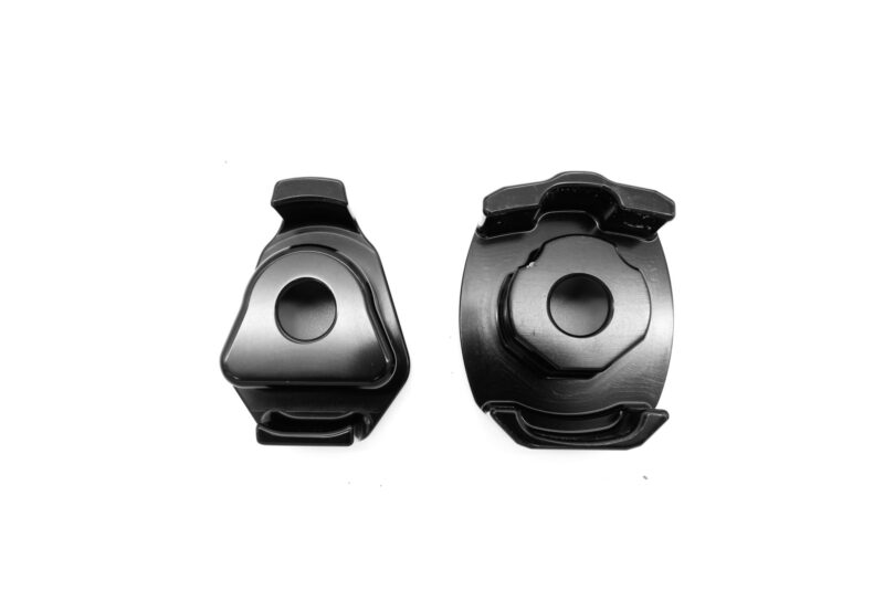 lower-motor-mount-twin-dogbone-inserts_52731701041_o-1jpg - OPSHOLDERS Two black metal clamps with rounded gripping jaws, placed side by side on a white background