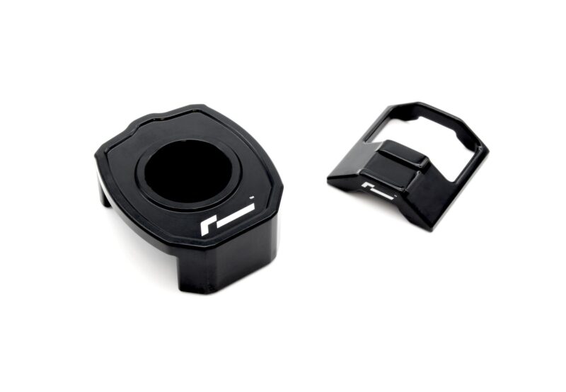 lower-motor-mount-twin-dogbone-inserts_52732108335_o-2jpg - OPSHOLDERS Close-up of a black plastic mount with a large circular opening and a separate hinged clamp on a white background.